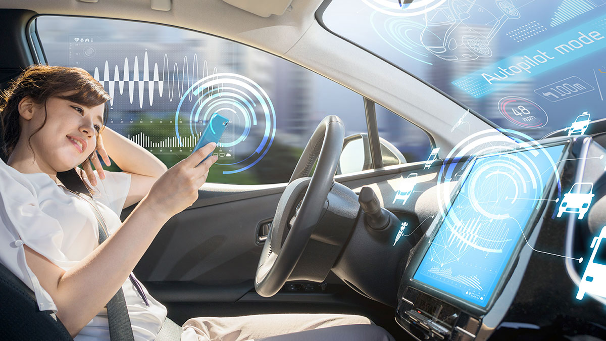 Credit Unions - woman driving autonomous car