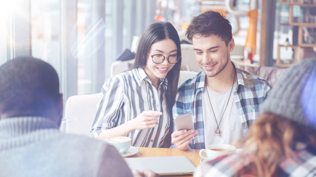 Couple looking at smart phone