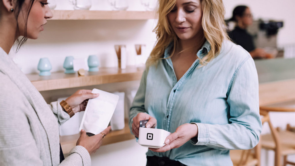 Temenos Payments - Woman checking out using Square