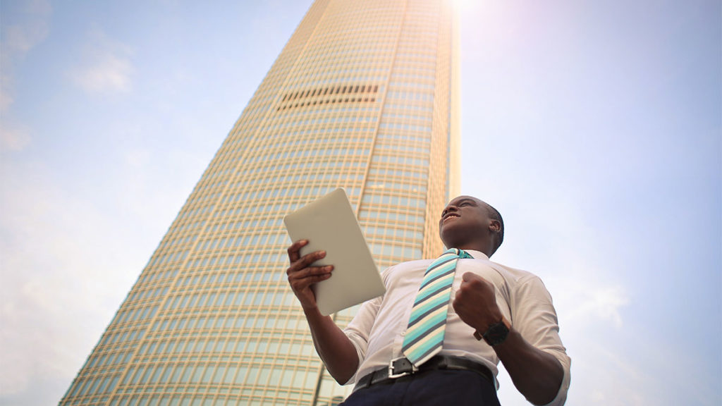 Fund Administration Multifonds Global Investor - Businessman in front of skyscraper