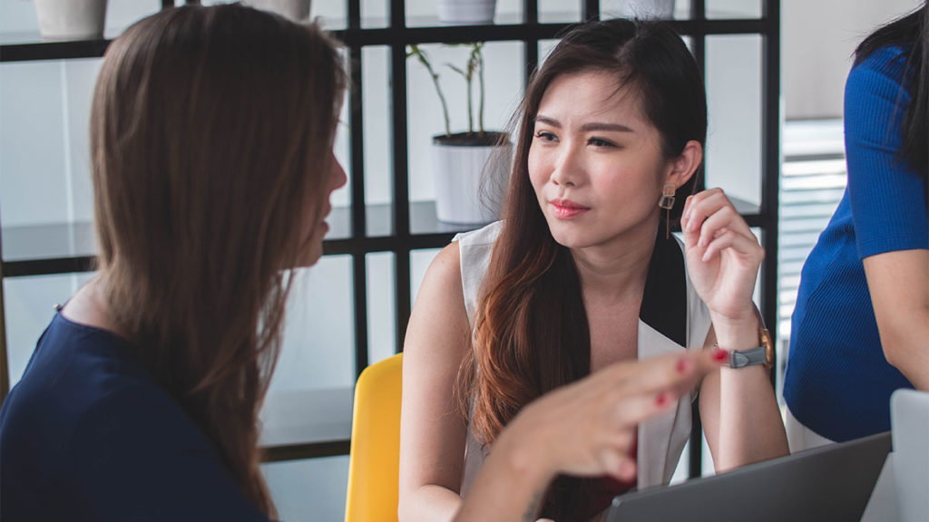 Regulatory Compliance - Experienced Women talking about work