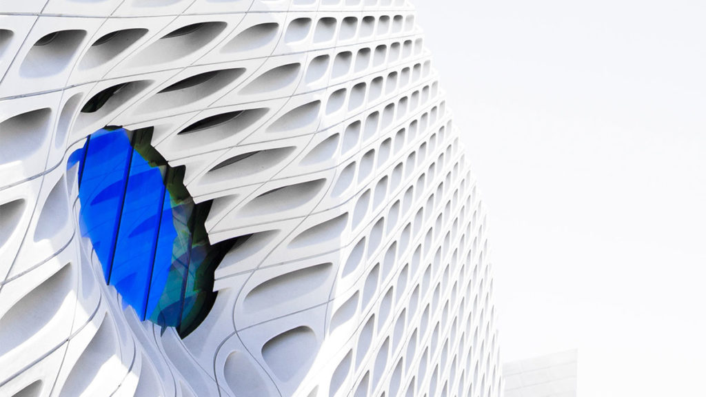 Regulatory Compliance - White building with blue window