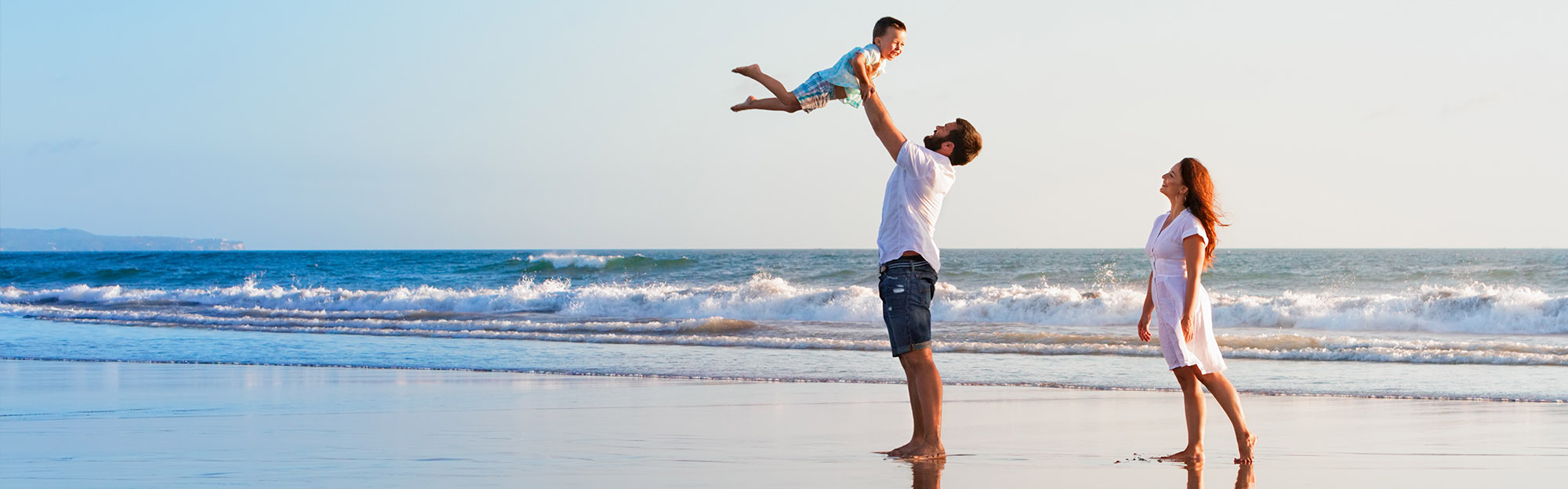 Wealth Management - Family playing on the beach