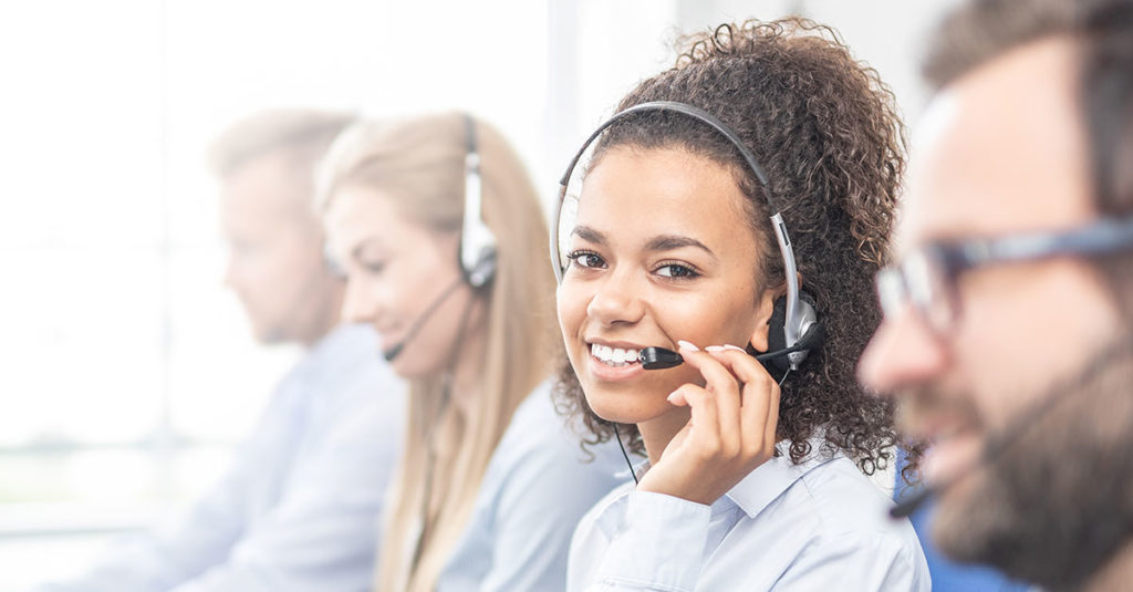 Temenos Customer Support and Services - smiling call centre worker
