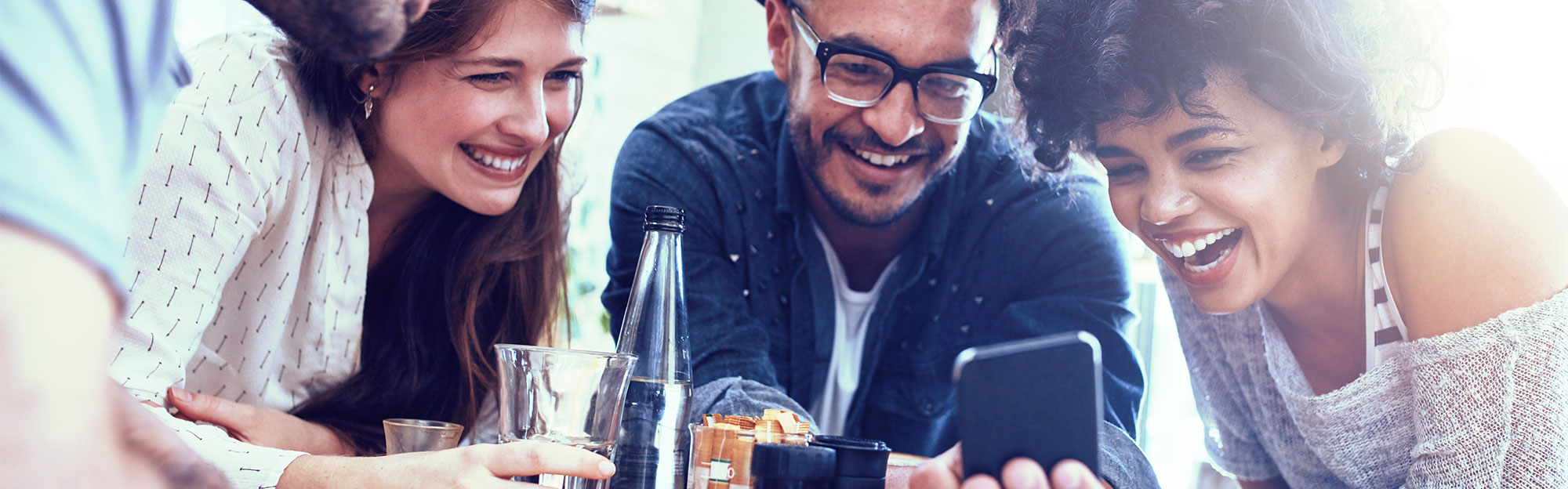 people gathered around a phone