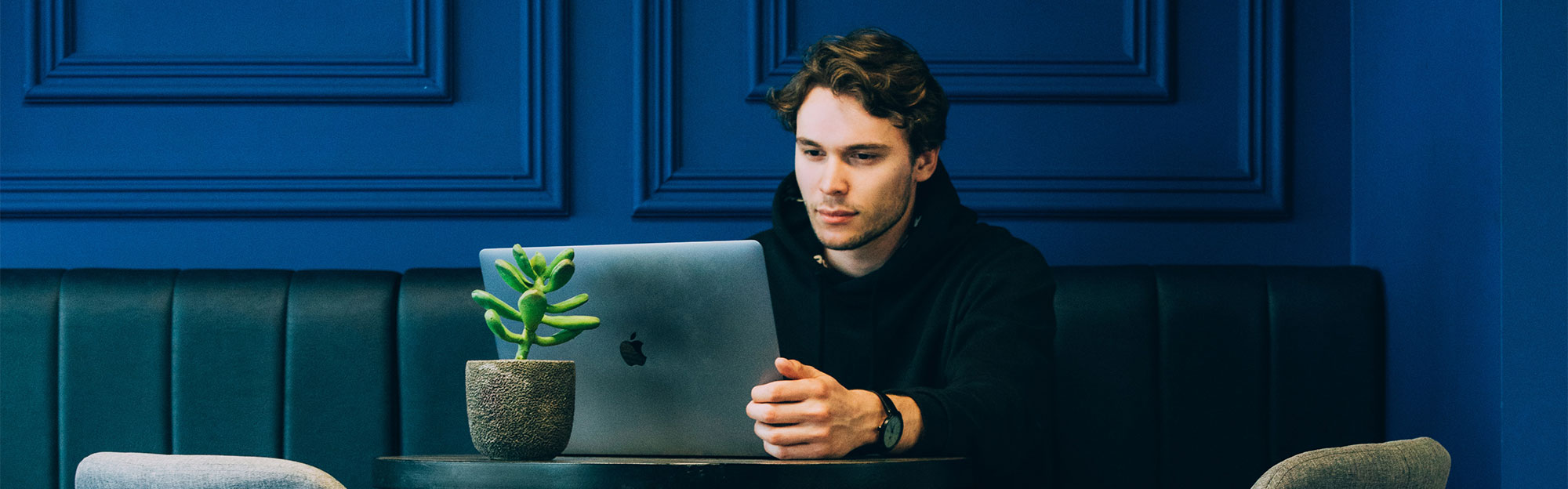 Webinar: Optimize Account Onboarding - Man with laptop